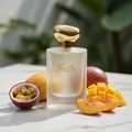 Fruitta Eau de Parfum bottle on white marble with tropical fruits